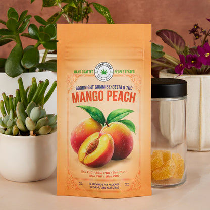 Mango peach gummy package with plants and a jar of gummies in the background